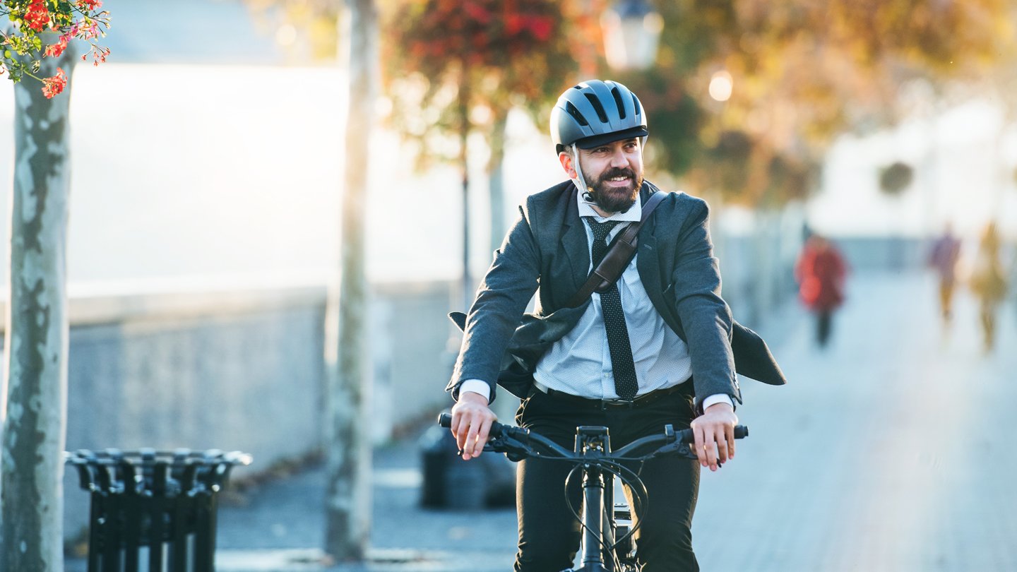 Corporate-and-social-man-on-bike-1140x810